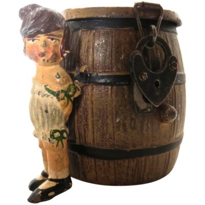 Spelter Still Bank "Girl By A Barrel" . German. Circa 1908