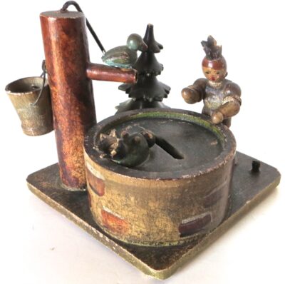 "Lady and Baby by The Wishing Well" Still Bank. German Circa 1910